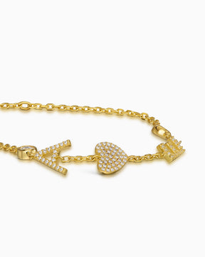Armband met letters en zirkonia met bedeltjes